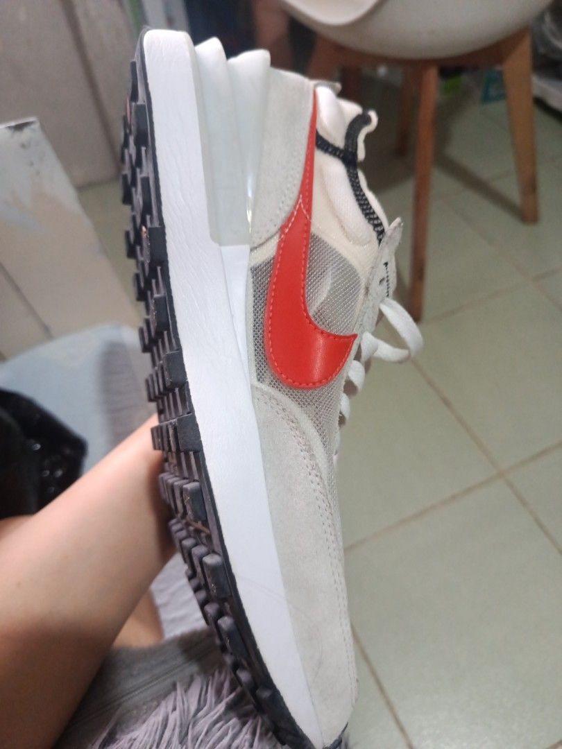 Nike Sacai Waffle White Red (Category: Sneakers) located in Pasig City. Submitted by cheryleenclaveria (Listing ID 1459955781, Image 3). Description: - Nike Sacai Waffle sneakers in white and red. - Unique layered sole design. - Combination mesh and suede upper. - Classic waffle outsole for excellent grip. - Ideal for both casual wear and running..