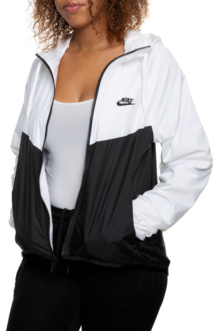 Nike Windrunner White Black Hooded Jacket Size S (Category: Coats, Jackets and Outerwear) located in Valencia. Submitted by cabisaythriftshop (Listing ID 1459977894, Image 1). Description: - Classic Nike windbreaker jacket - White and black color blocking - Hooded design with full zip closure - Two convenient front pockets - Lightweight material, ideal for layering - Perfect for casual outings or light outdoor activities - Iconic Nike Swoosh logo