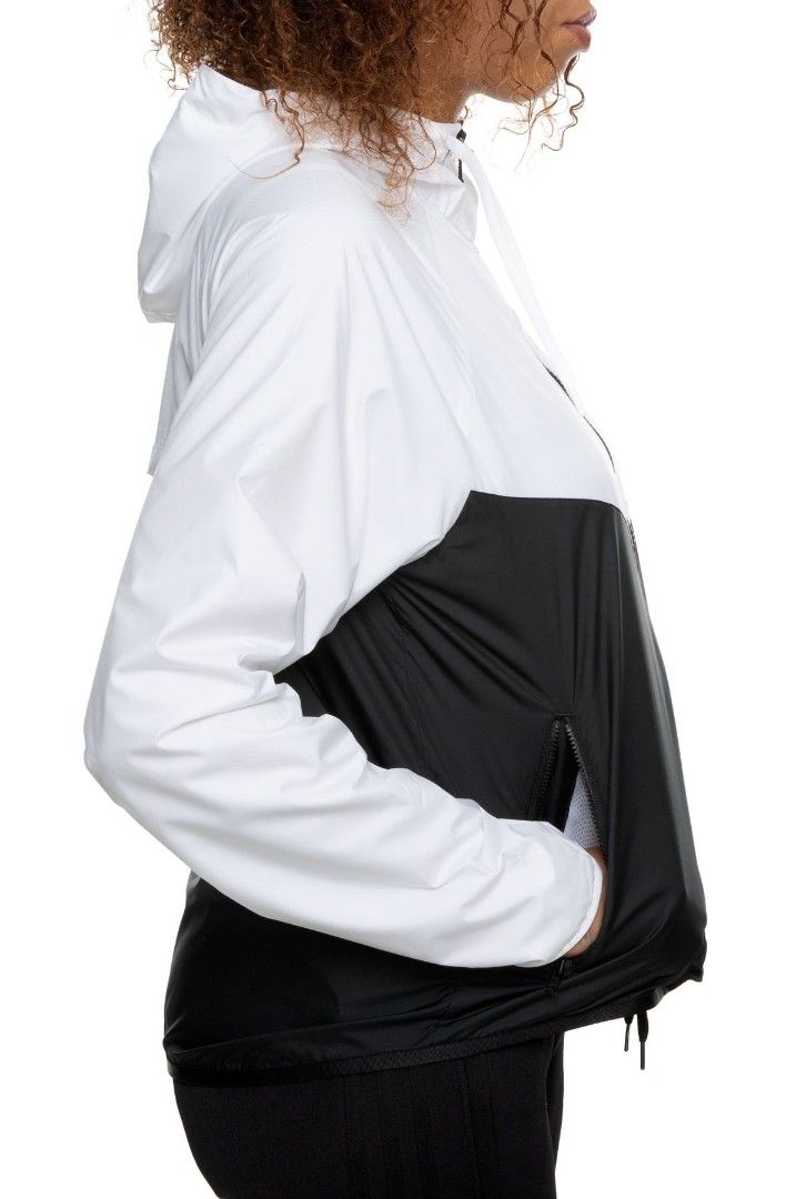 Nike Windrunner White Black Hooded Jacket Size S (Category: Coats, Jackets and Outerwear) located in Valencia. Submitted by cabisaythriftshop (Listing ID 1459977894, Image 3). Description: - Classic Nike windbreaker jacket - White and black color blocking - Hooded design with full zip closure - Two convenient front pockets - Lightweight material, ideal for layering - Perfect for casual outings or light outdoor activities - Iconic Nike Swoosh logo