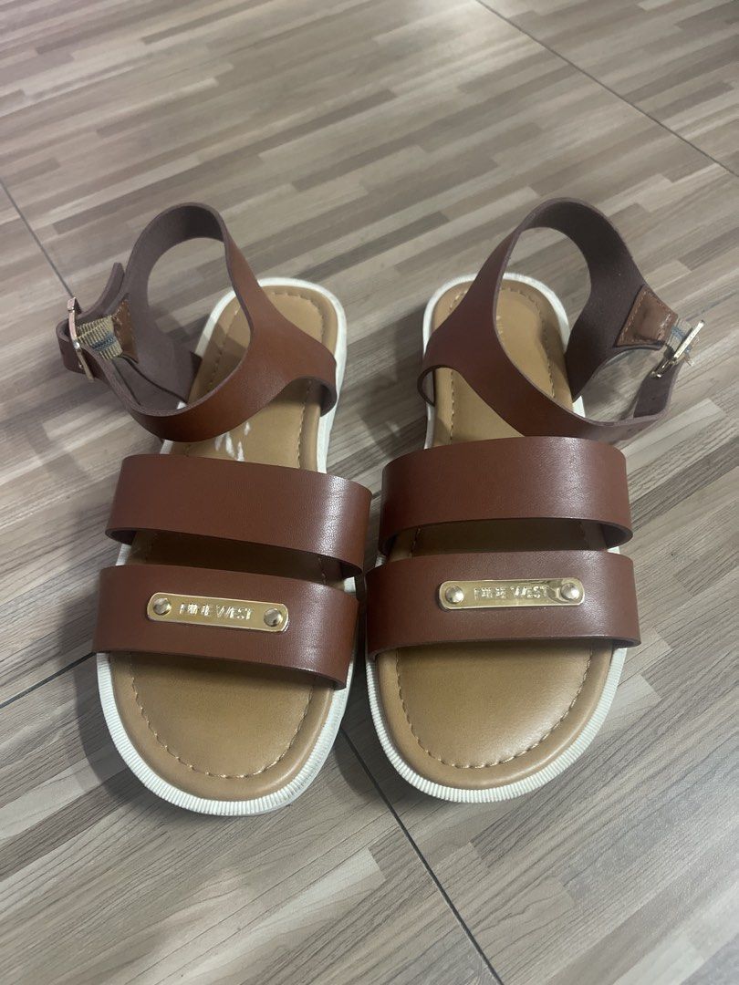 Nine West Brown Leather Strap Sandals (Category: Babies & Kids Fashion) located in Makati City. Submitted by eunice_tr (Listing ID 1459934124, Image 1). Description: - Brand: Nine West - Material: Brown Leather - Design: Two straps across the foot - Closure: Buckle at ankle strap - Comfort: Comfortable sole - Occasion: Great for casual wear Size: 1.