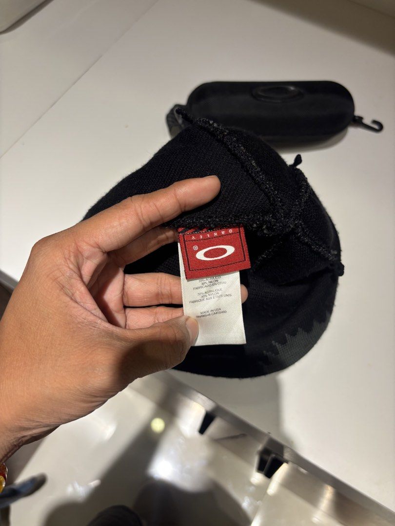 Oakley Black Knit Beanie with Grey Pattern (Category: Caps & Hats) located in Quezon City. Submitted by fordzz (Listing ID 1459971383, Image 2). Description: - Brand: Oakley - Color: Black with cool grey zigzag pattern - Material: Acrylic and Nylon blend - Features: Comfortable knit, keeps you warm - Detail: Oakley logo on inside tag - Condition: Ready for a new owner.