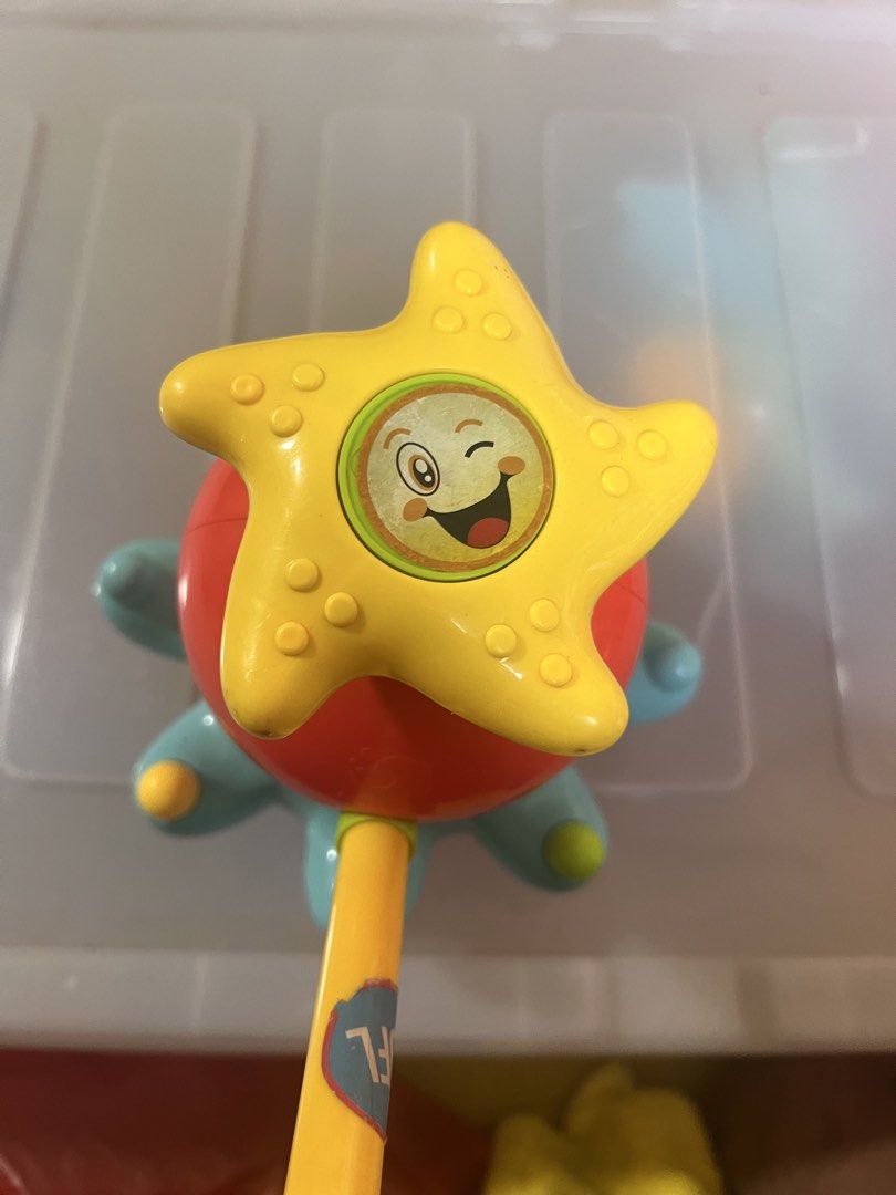 Octopus Bath Toy with Spinning Star and Handle (Category: Kids Toys) located in Taguig. Submitted by amorzy (Listing ID 1460023210, Image 2). Description: - Fun octopus bath toy for kids - Star on top spins when handle is pushed - Bright orange and blue colors - Tentacles have pressable balls - Made in China - Perfect for making bath time enjoyable Location: Upper Bicutan.