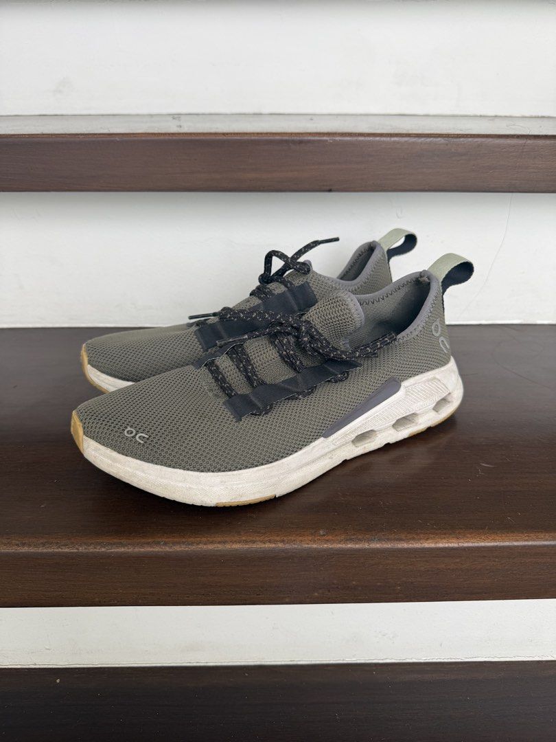 ON Cloud Men's Cloudeasy Olive Green (Category: Sneakers) located in Cebu City. Submitted by takeitfrom.me (Listing ID 1459937330, Image 1). Description: - ON Cloud sneakers in olive green - Lightweight and breathable mesh upper - Easy slip-on design with elastic laces - Unique sole with cushioning technology - Perfect for everyday wear or light workouts - Note: Minor scuffs on the sole from normal use.