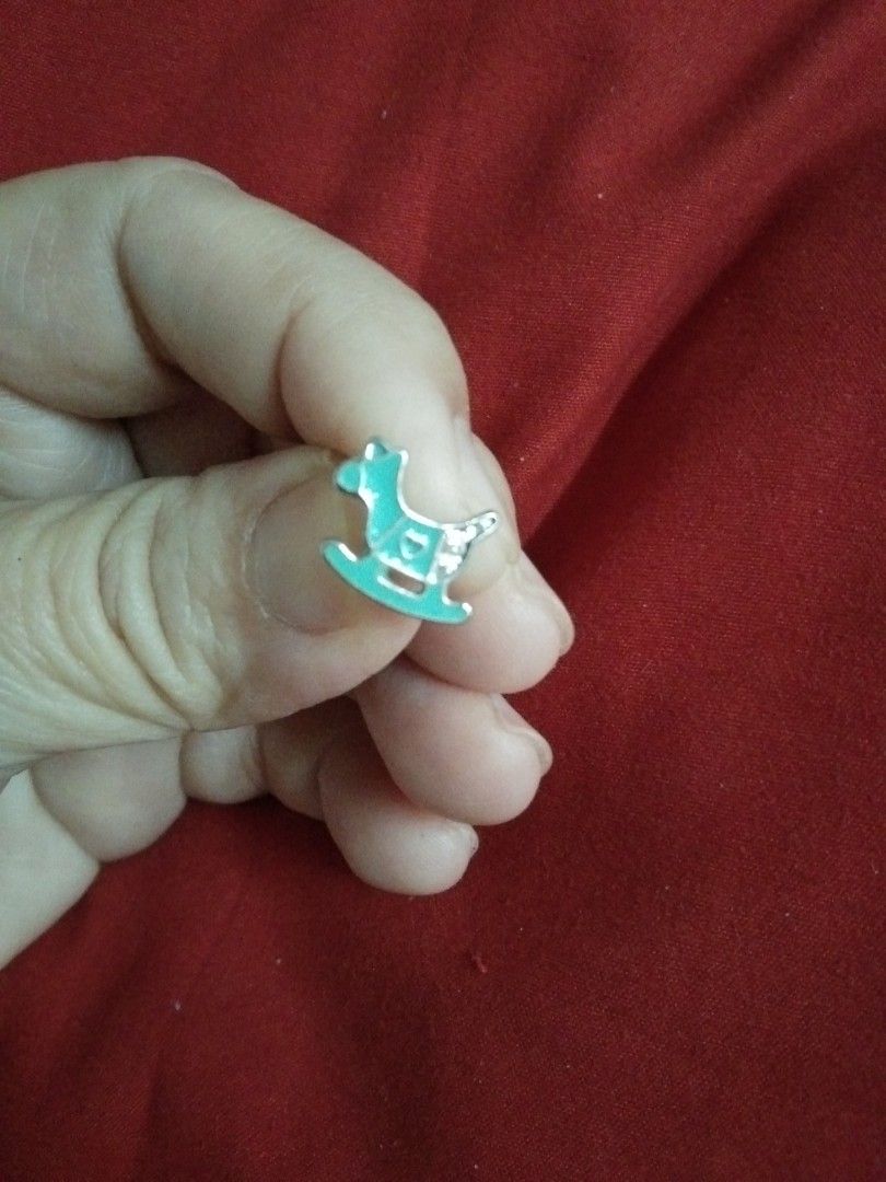 One pc rocking chair stud earrings (Category: Earrings) located in Quezon City. Submitted by eidorableshop (Listing ID 1459905008, Image 1). Description: - Adorable stud earrings set. - Features a rocking horse design with blue enamel and heart details. - Includes a fun soccer ball design. - Perfect for adding a playful touch to any outfit. - Ideal for kids or those who love whimsical accessories. - Lightweight and comfortable for all-day wear..