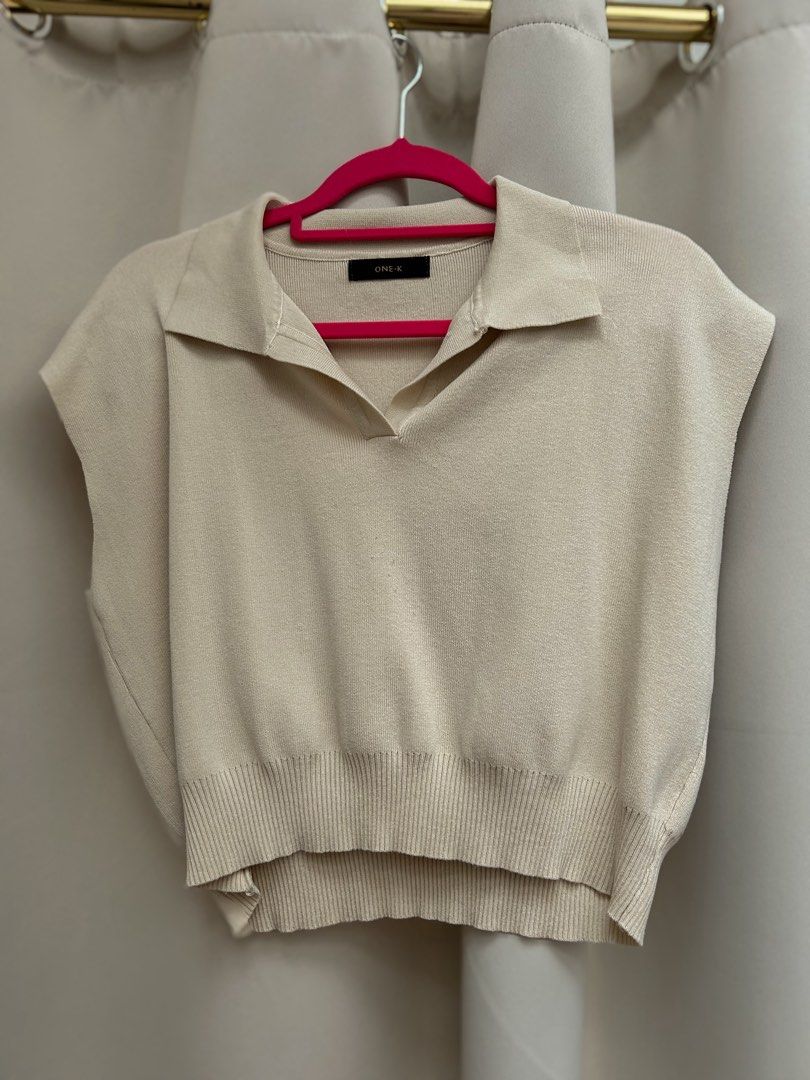 ONE-K Beige Sleeveless Collared Knit Top (Category: Sleeveless) located in Cainta. Submitted by unboxingstuff (Listing ID 1459970260, Image 1). Description: - Beige knit sleeveless top - Brand: ONE-K - Features a collar and V-neckline - Ribbed hem detail - Versatile: great for layering or wearing on its own - Made from super comfy knit material - Bought in Thailand.