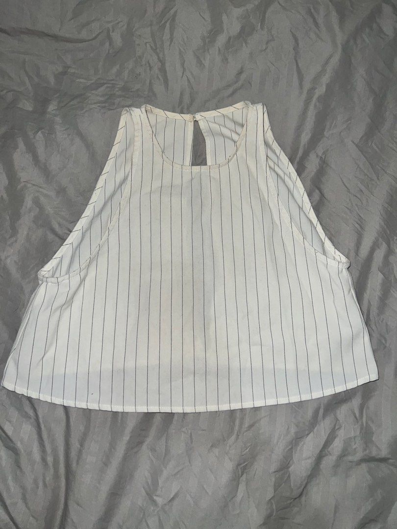 Open Linen Top with Stripes XS-S (Category: Sleeveless) located in Paranaque City. Submitted by michcianox (Listing ID 1460013842, Image 1). Description: Open back soft and breathable sleeveless. L on tag (probably kid’s size) but XS TO S on actual sizing Price does not include shipping fee Can ship through lalamove perfect for swimwear cover up after beach time! 📍meet up location: SM Sucat 💵 payment through gcash/maya.
