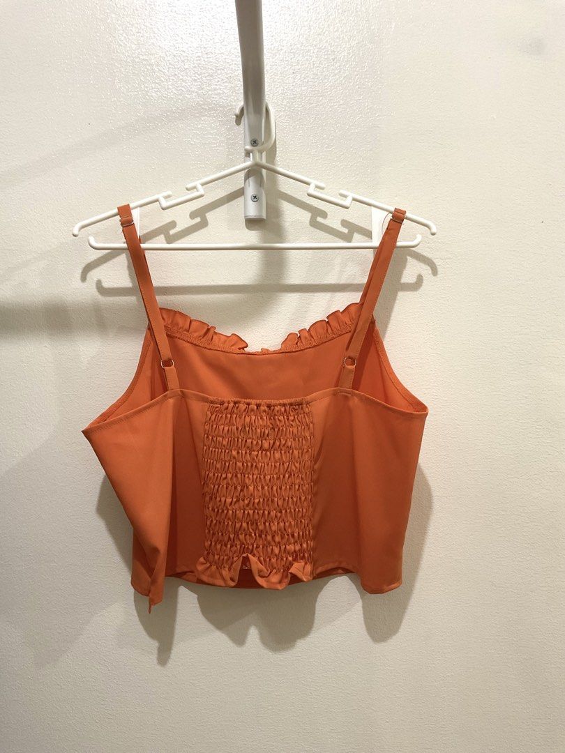 Orange Sleeveless Ruffles Top (Category: Sleeveless) located in Manila. Submitted by ilovecheesyramen (Listing ID 1460061879, Image 2). Description: 🪩 used only once! quality is good as neww 🪩 perfect for summer casual fits! 🪩 rfs: decluttering 🪩 size M.