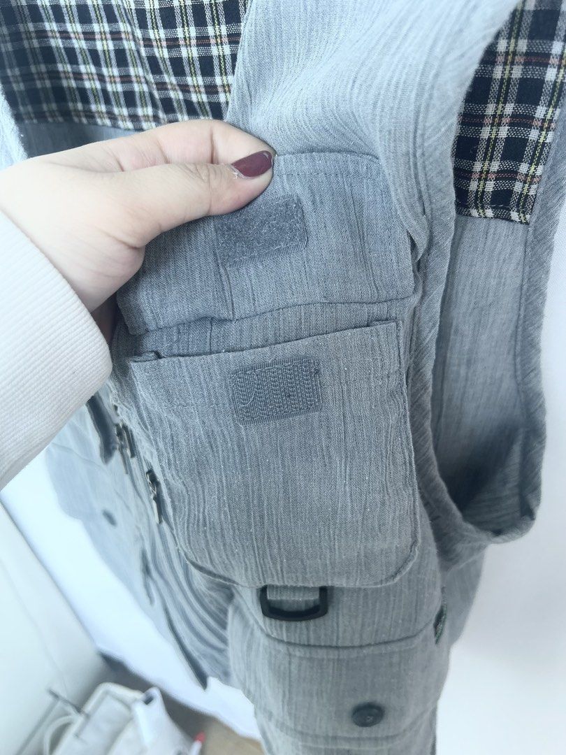 Oscar Jones Light Blue Utility Vest (Category: Vests) located in Manila. Submitted by anjidoll_ (Listing ID 1459984054, Image 3). Description: - Light blue utility vest by Oscar Jones - Multiple pockets with zippers and buttons for ample storage - Lined with a classic plaid pattern - Front zipper closure for easy wear - Perfect for layering over outfits - Versatile for outdoor activities or a casual streetwear aesthetic -can be UNISEX MOP: gcash 