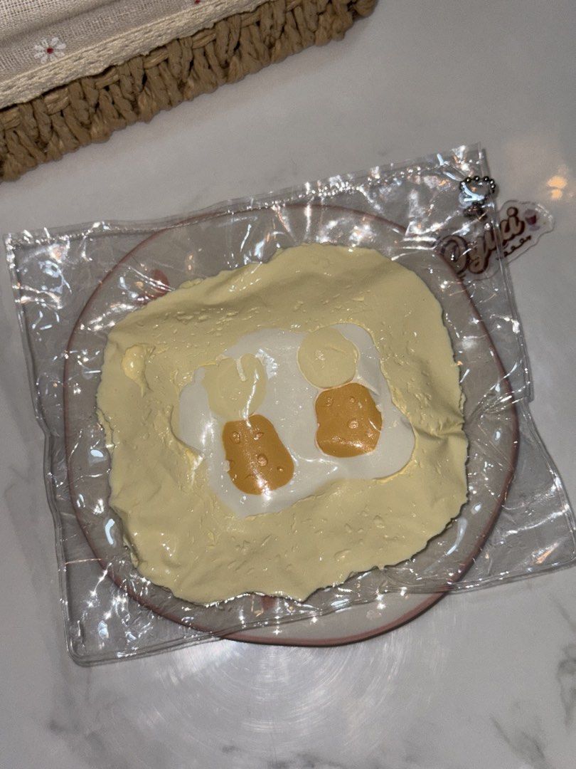 Oyixi Egg Toast Taba Squishy (Category: Designer & Blind Box Toys) located in Baliuag. Submitted by shaiilv (Listing ID 1460080337, Image 3). Description: Soft and creamy! Slow rising! ~ comes with free pouch.