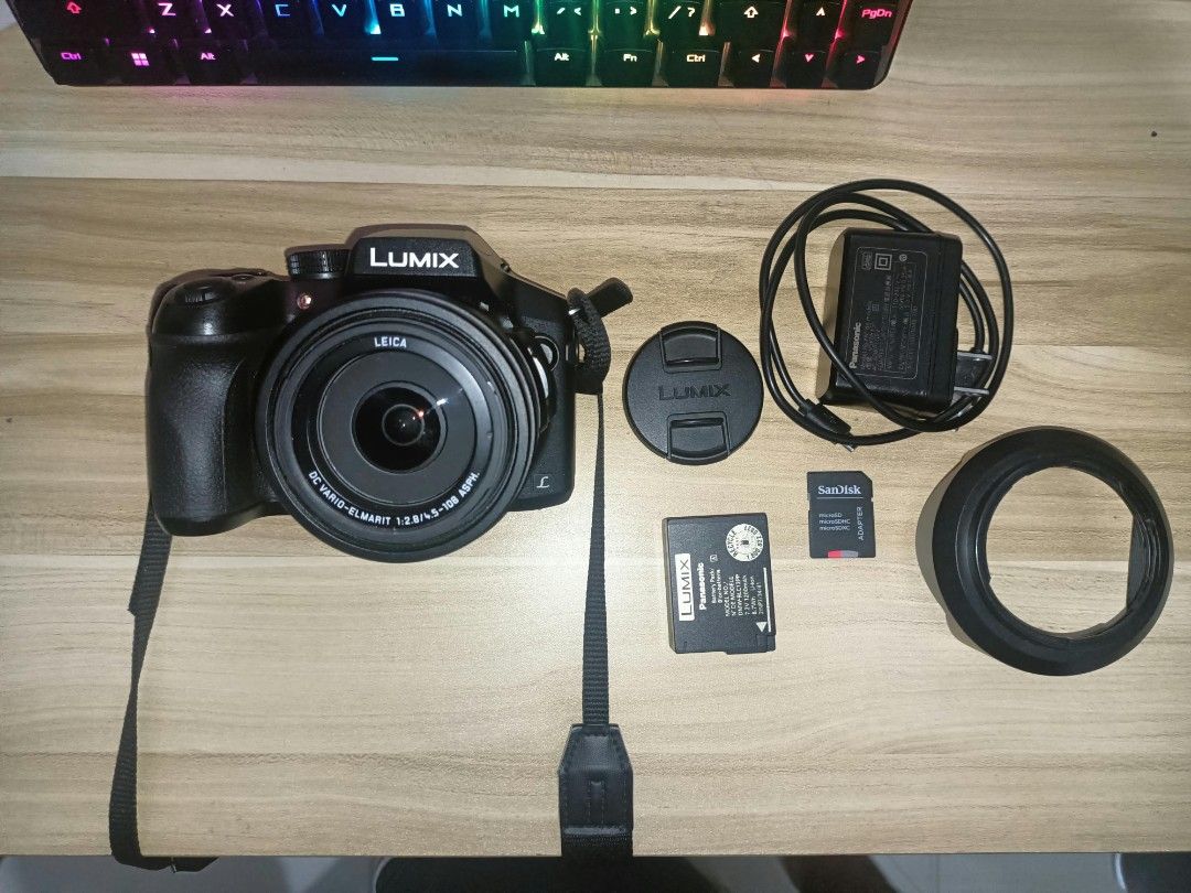 Panasonic Lumix DMC FZ300 (Category: Cameras) located in Manila. Submitted by mightycat-88a7 (Listing ID 1460104545, Image 2). Description: The Panasonic Lumix DMC-FZ300 is a weather-sealed bridge superzoom camera featuring a constant f/2.8 zoom lens and 4K video recording. Key Specifications: Sensor: 12.1-megapixel 1/2.3-inch BSI-CMOS sensor Lens: 25-600mm equivalent (24x optical zoom) with a constant f/2.8 aperture across the entire zoom range 