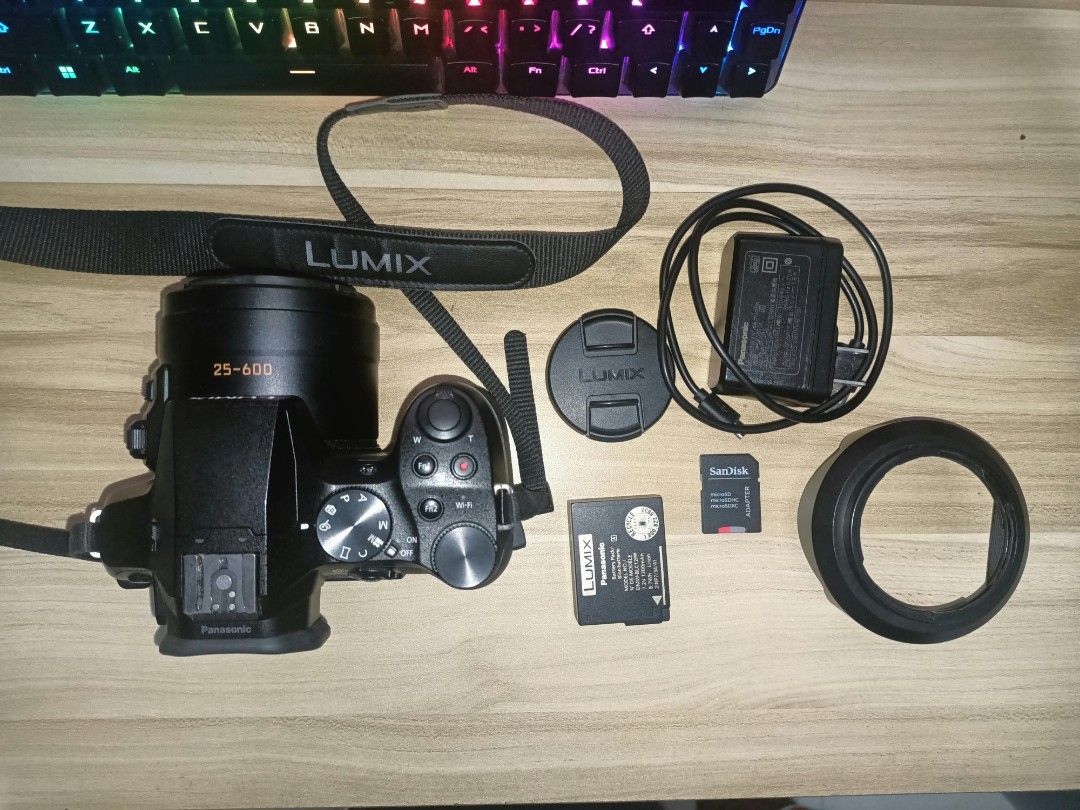 Panasonic Lumix DMC FZ300 (Category: Cameras) located in Manila. Submitted by mightycat-88a7 (Listing ID 1460104545, Image 3). Description: The Panasonic Lumix DMC-FZ300 is a weather-sealed bridge superzoom camera featuring a constant f/2.8 zoom lens and 4K video recording. Key Specifications: Sensor: 12.1-megapixel 1/2.3-inch BSI-CMOS sensor Lens: 25-600mm equivalent (24x optical zoom) with a constant f/2.8 aperture across the entire zoom range 