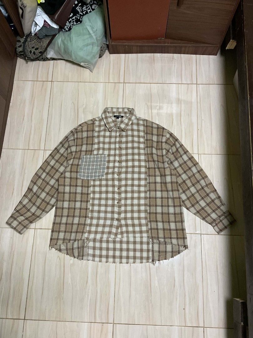 Patchwork Plaid Flannel Shirt (Category: Tshirts & Polo Shirts ) located in Caloocan City. Submitted by alarconarr59167 (Listing ID 1460033986, Image 1). Description: - Unique patchwork flannel shirt - Features a mix of different plaid patterns - Raw hem detail for a stylish look - Classic button-up front - Ideal for layering over other tops.