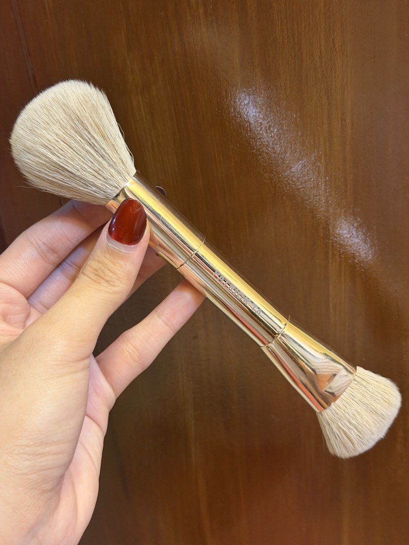 Patrick Ta Double-Ended Makeup Brush (Category: Makeup) located in Manila. Submitted by sonnyangie (Listing ID 1460054222, Image 2). Description: brandnew with box rfs: i have 2 - Patrick Ta Double-Ended Makeup Brush - Elegant gold handle with soft bristles - One end: Fluffy powder brush for seamless application - Other end: Smaller, dense brush ideal for precise contouring or highlighting - A versatile essential for any makeup kit.