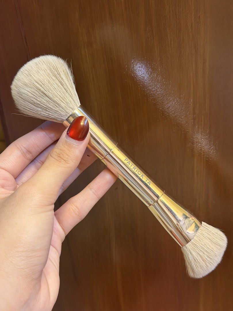 Patrick Ta Double-Ended Makeup Brush (Category: Makeup) located in Manila. Submitted by sonnyangie (Listing ID 1460054222, Image 3). Description: brandnew with box rfs: i have 2 - Patrick Ta Double-Ended Makeup Brush - Elegant gold handle with soft bristles - One end: Fluffy powder brush for seamless application - Other end: Smaller, dense brush ideal for precise contouring or highlighting - A versatile essential for any makeup kit.