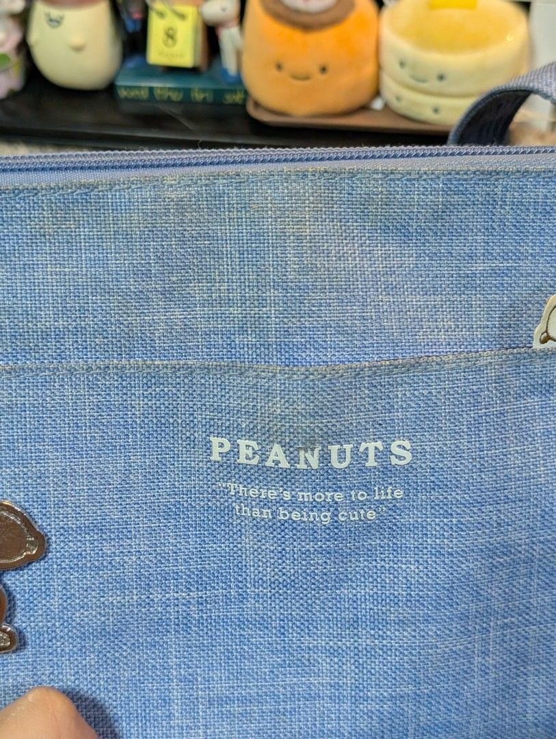 Peanuts Snoopy Sling Bag (Category: Cross-body Bags) located in San Pedro. Submitted by eurisilvers (Listing ID 1460052126, Image 2). Description: slight stain and chipped off logo but has a lot of compartments inside + zippers are still good. — shipping is via J&T Express — mop: gcash, maya, bank transfer — location: san pedro city, laguna.