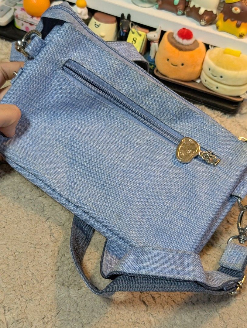 Peanuts Snoopy Sling Bag (Category: Cross-body Bags) located in San Pedro. Submitted by eurisilvers (Listing ID 1460052126, Image 3). Description: slight stain and chipped off logo but has a lot of compartments inside + zippers are still good. — shipping is via J&T Express — mop: gcash, maya, bank transfer — location: san pedro city, laguna.