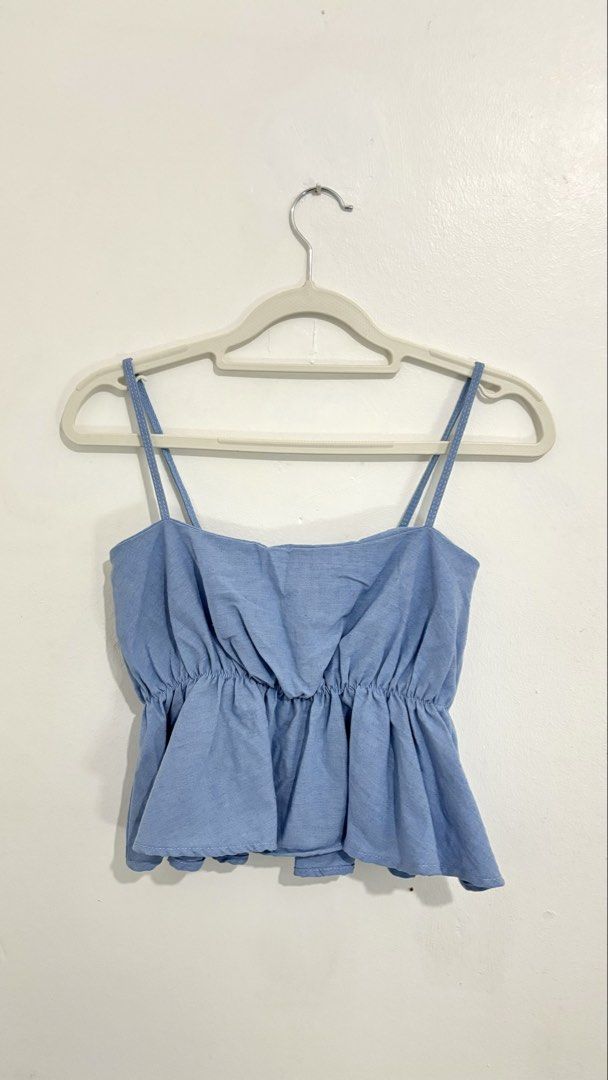 Peplum Cami Top (Category: Sleeveless) located in Caloocan City. Submitted by buymethisandthat (Listing ID 1460031684, Image 1). Description: ✨ Light Blue Elasticized Peplum Cami Top - ₱99 📌 CONDITION • Condition: 8.5/10 • Flaws: None visible 📏 SIZE • Tag Size: No size tag • Recommended: Fits Small to Medium (stretch gathered elastic bust and waist).