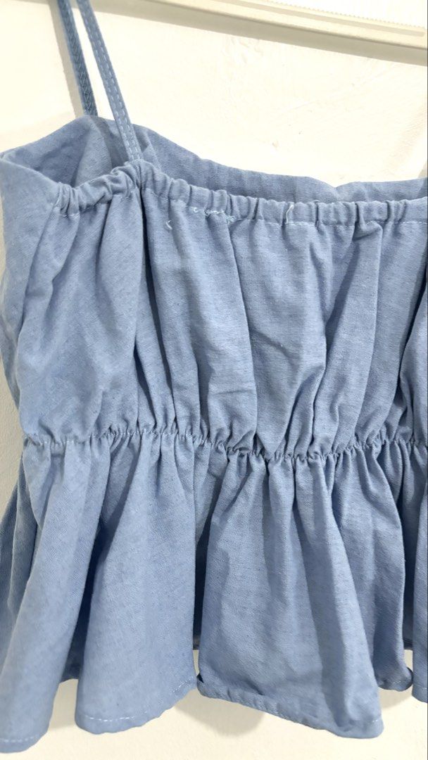 Peplum Cami Top (Category: Sleeveless) located in Caloocan City. Submitted by buymethisandthat (Listing ID 1460031684, Image 3). Description: ✨ Light Blue Elasticized Peplum Cami Top - ₱99 📌 CONDITION • Condition: 8.5/10 • Flaws: None visible 📏 SIZE • Tag Size: No size tag • Recommended: Fits Small to Medium (stretch gathered elastic bust and waist).