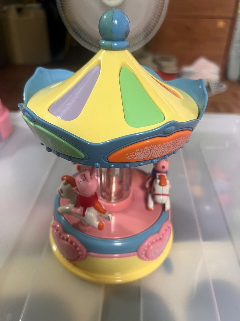 Peppa Pig Carousel Music Box Toy (Category: Kids Toys) located in Taguig. Submitted by amorzy (Listing ID 1460021168, Image 2). Description: - Cute Peppa Pig carousel music box - Plays happy tunes and lights up when on - Features Peppa Pig characters riding horses - Battery operated (switch located on the bottom) - Ideal gift for young Peppa Pig enthusiasts - Fun toy for playtime Location: Upper Bicutan.