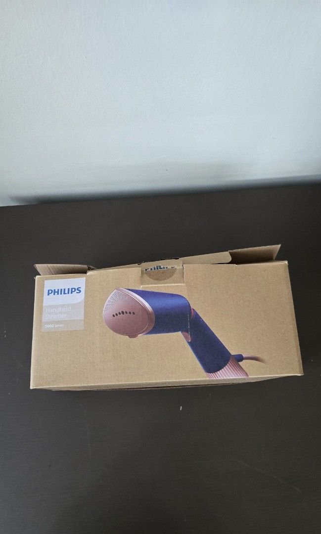 Philips Handheld Steamer 5000 Series (Category: Irons & Steamers) located in Kuala Lumpur. Submitted by chillax33401 (Listing ID 1459928362, Image 1). Description: - Philips 5000 Series Handheld Steamer - Comes with water tank, brush attachment, and heat-resistant glove - Ideal for quick clothing touch-ups - Easy to use and store - Perfect for travel or home use.
