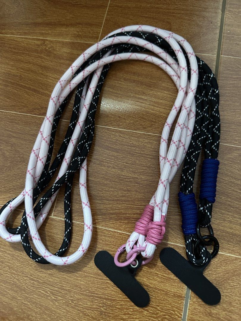 Phone Lanyard Strap with T-Tab (Category: Other Mobile & Gadget Accessories) located in Mandaluyong City. Submitted by vastrabbit.138b36 (Listing ID 1459931092, Image 1). Description: - Adjustable phone lanyard straps - Available in black/white with pink accents, and black/blue - Features a T-tab for easy and secure phone attachment - Wearable around your neck or as a crossbody strap - Keeps your phone secure and accessible.