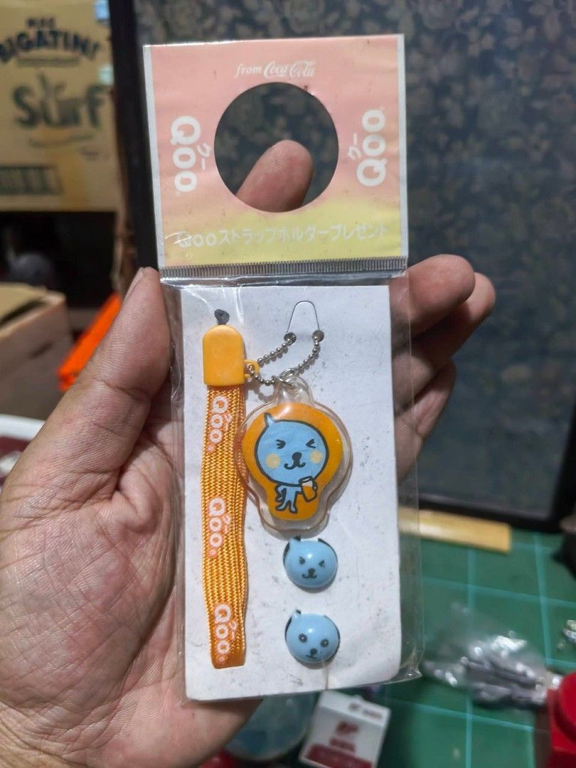 Phone Strap - Coca-Cola Qoo Character Strap and Charm Set. (Category: Other Mobile & Gadget Accessories) located in Cebu City. Submitted by dudes_villanueva (Listing ID 1459933928, Image 1). Description: Phone Strap - Coca-Cola Qoo Character Strap and Charm Set. 📌 Type: Promotional mobile phone strap and accessory holder. 📌 Character: Qoo, the blue mascot from the popular juice drink. 📌 Included Pieces: An orange fabric strap, a main Qoo chara