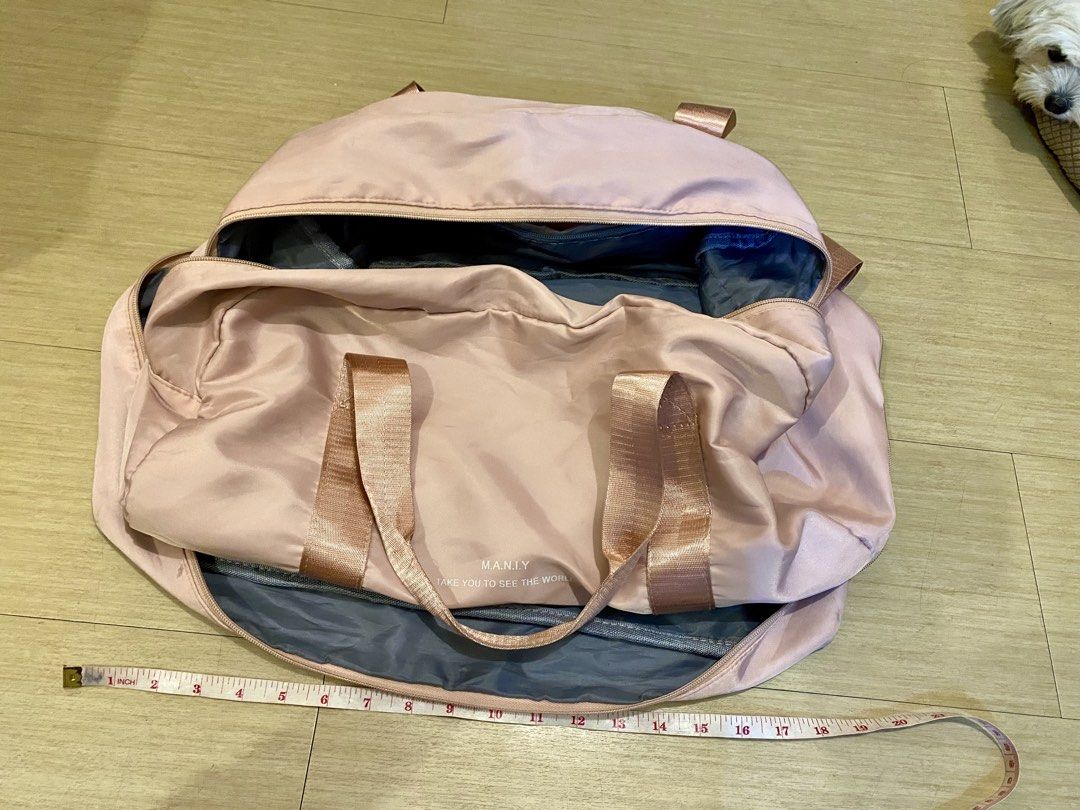 Pink Duffle Bag (Category: Shoulder Bags) located in Manila. Submitted by lovendinol14982 (Listing ID 1460031778, Image 1). Description: - Stylish pink duffle bag - Elegant rose gold straps and hardware - Multiple zippered compartments for organization - Spacious main compartment for all your essentials - Ideal for gym sessions or weekend getaways - Approximately 18 inches in length - Clean inside and out, ready for use.