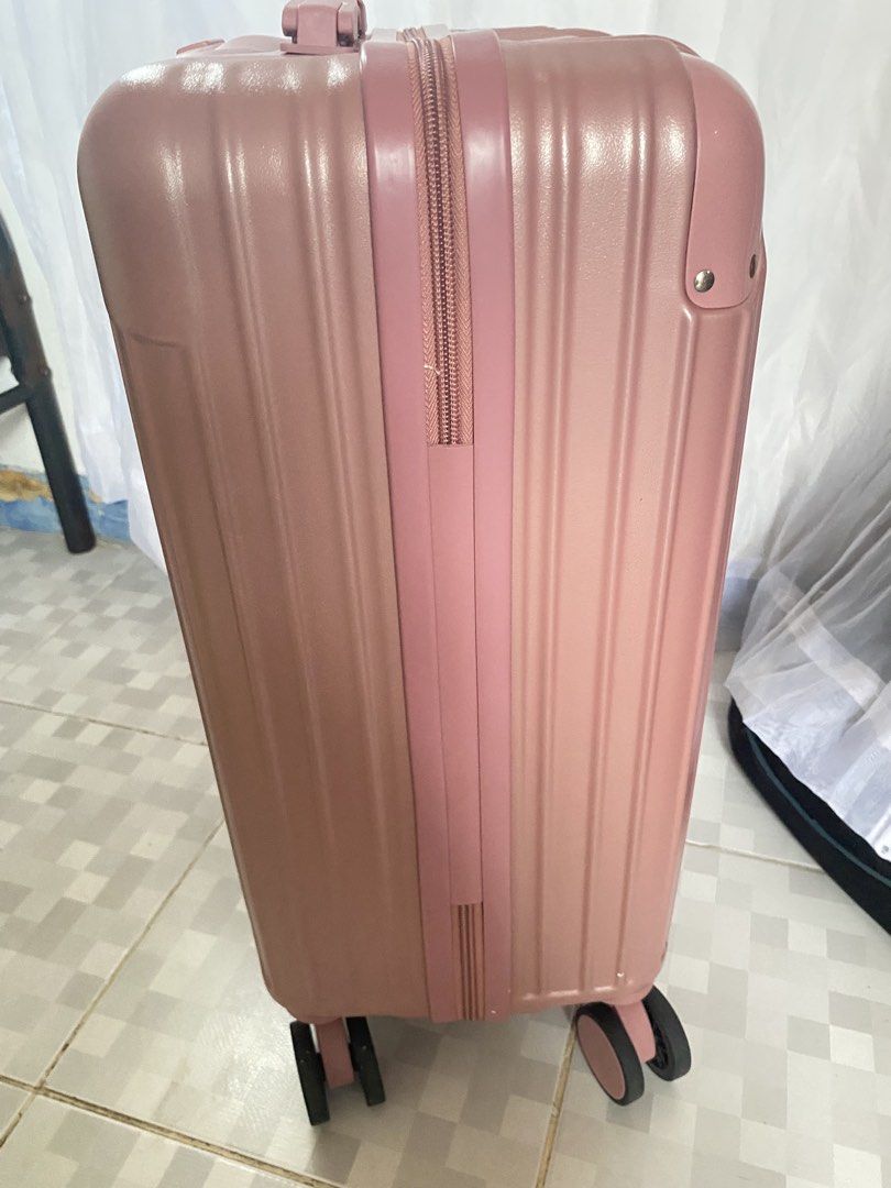 Pink Hardshell Cabin Luggage with Wheels (Category: Luggage) located in Imus. Submitted by wheagirl (Listing ID 1460006200, Image 2). Description: - Pink hardshell cabin luggage - Easy transport with wheels - Secure zipper closure - Extendable handle for convenience - Ideal for short trips or carry-on luggage - Durable and ready for your next adventure.