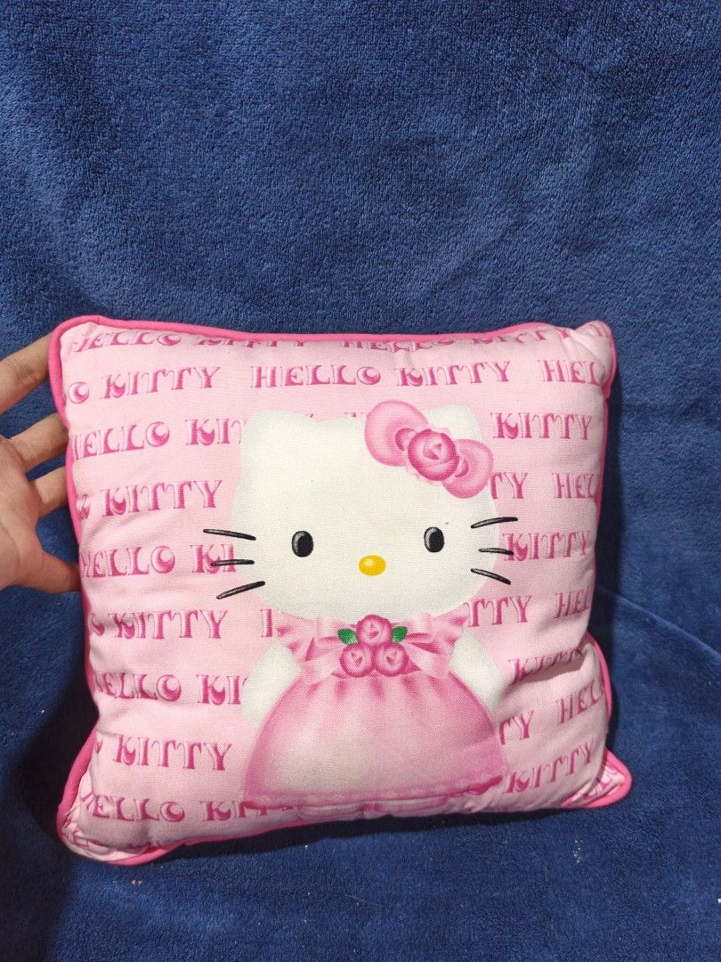 Pink Hello Kitty Throw Pillow Cushion (Category: Cushions & Throws) located in Manila. Submitted by kirstentoyshub (Listing ID 1459972516, Image 1). Description: - Adorable pink Kitty pillow. - Features a large Kitty graphic on the front. - All-over repeating ' Kitty' pattern. - Soft and squishy material. - Ideal for Kitty fans or as a decorative accent..