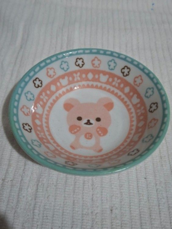 Pink Korilakkuma Small Shallow Bowl (Category: Dinnerware & Cutlery) located in Consolacion. Submitted by luxekerei (Listing ID 1458893150, Image 1). Description: - small ceramic bowl featuring the character Korilakkuma from the San-X Rilakkuma series. - 11.5cm diameter ; 3.5cm depth.