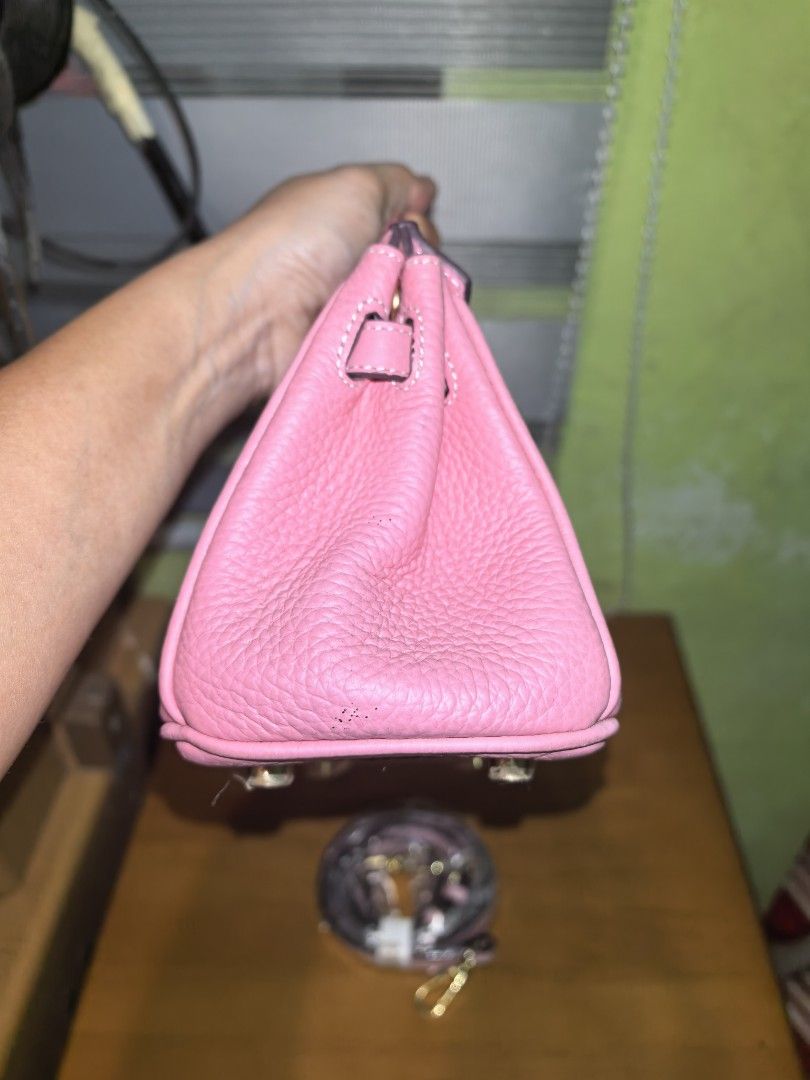 Pink Leather Top Handle Bag with Shoulder Strap (Category: Shoulder Bags) located in Manila. Submitted by mysticfox.9b1678 (Listing ID 1459961687, Image 3). Description: - Adorable pink leather bag - Includes a detachable shoulder strap - Features elegant gold hardware details - Protective stickers still on bottom studs - Versatile for everyday or special events - Spacious interior for your essentials.