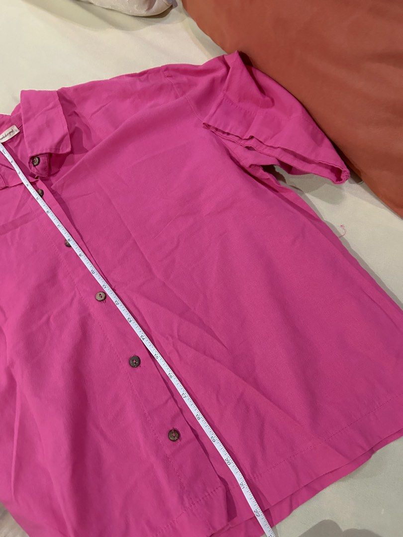 Pink Linen Button-down Polo (Category: Shirts) located in Cainta. Submitted by unboxingstuff (Listing ID 1460042059, Image 3). Description: - Hot pink button-up linen polo - Features natural wooden buttons - Short sleeves and collared neckline - Relaxed fit for comfort - Ideal for casual outfits or as a layering piece - Size: L.