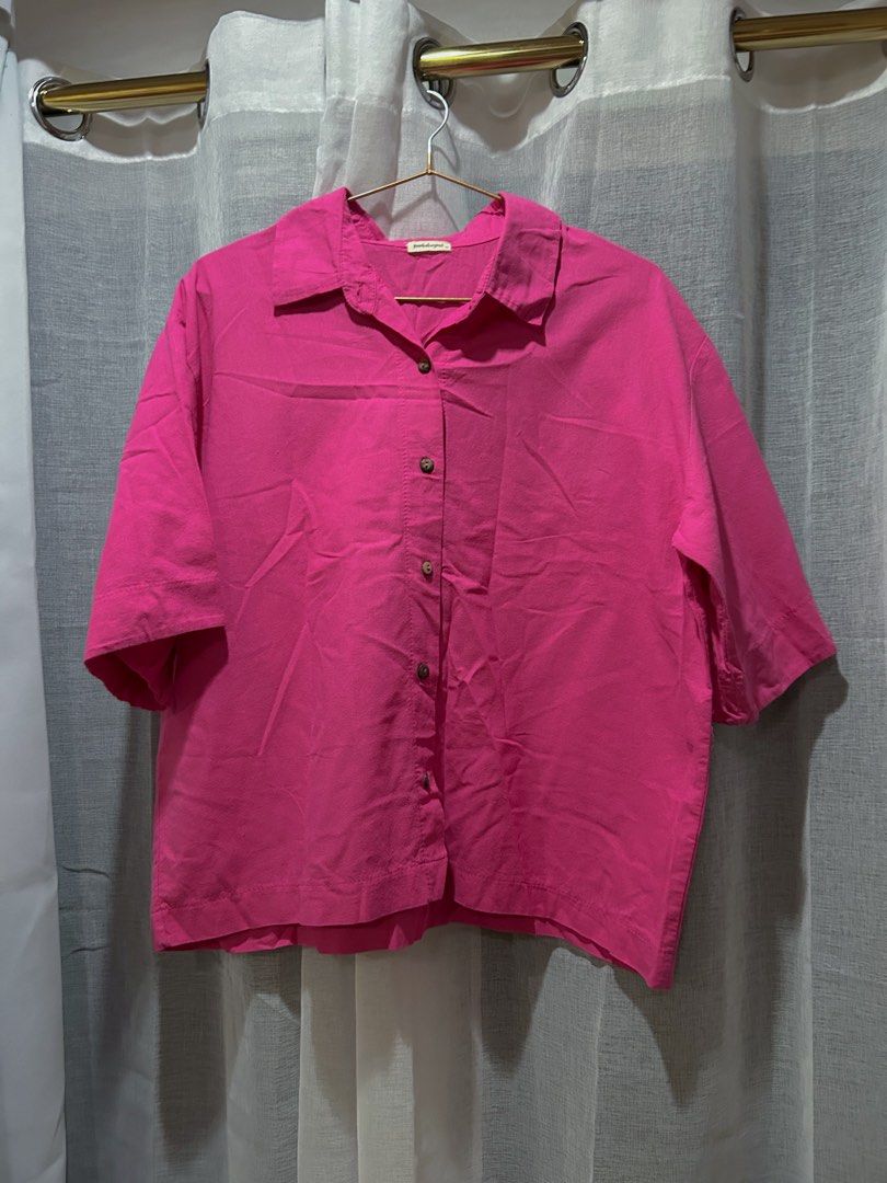 Pink Linen Button-down Polo (Category: Shirts) located in Cainta. Submitted by unboxingstuff (Listing ID 1460042059, Image 1). Description: - Hot pink button-up linen polo - Features natural wooden buttons - Short sleeves and collared neckline - Relaxed fit for comfort - Ideal for casual outfits or as a layering piece - Size: L.