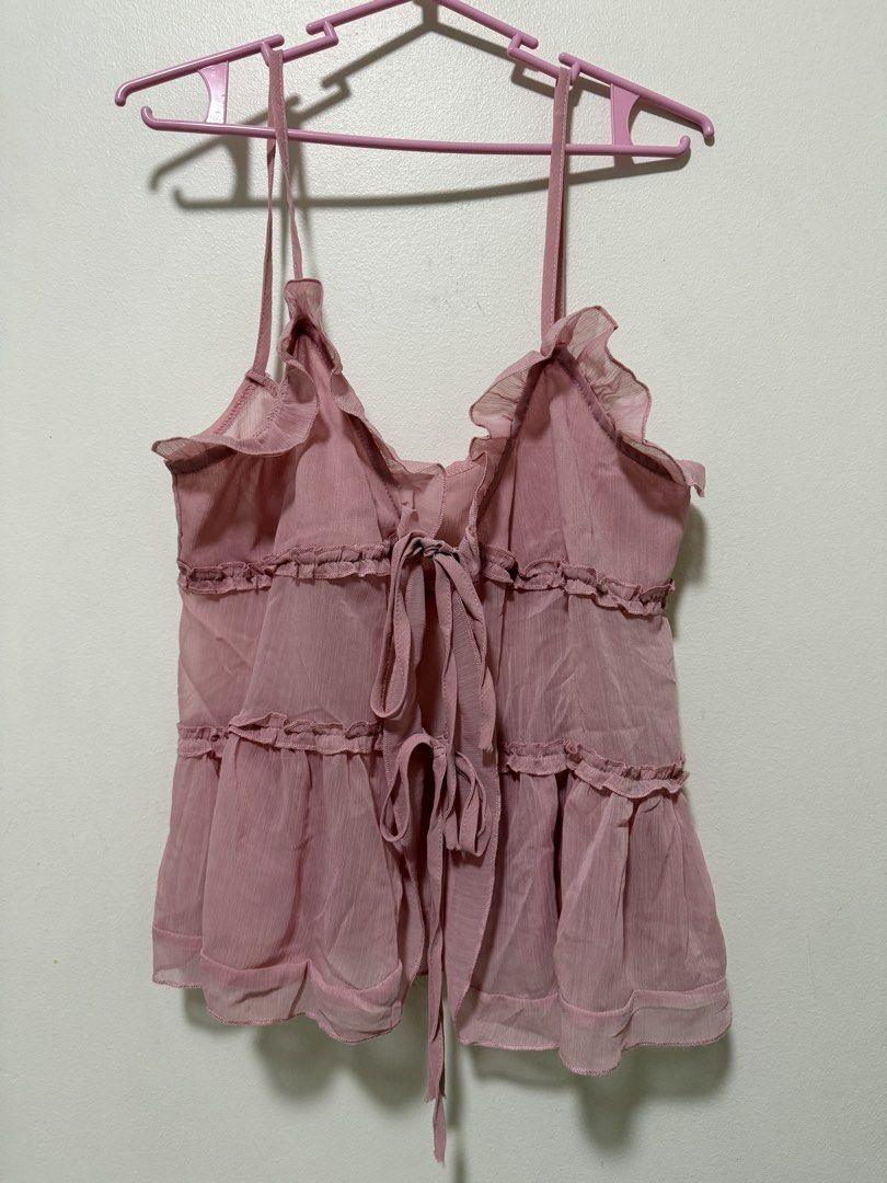 Pink semi transparent cami top (Category: Sleeveless) located in Quezon City. Submitted by clothe.kr (Listing ID 1460049048, Image 1). Description: Used once Runs a bit big, can fit M.