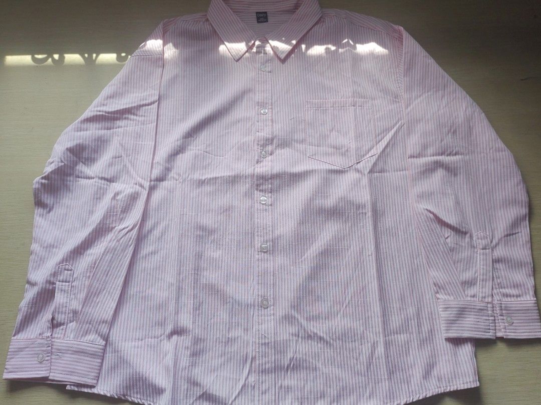 Pink Striped Button-Up Longsleeve (Category: Tshirts & Polo Shirts ) located in Quezon City. Submitted by brycine022416 (Listing ID 1460074299, Image 1). Description: - Classic pink and white striped button-up shirt - Long sleeves with button cuffs - Single chest pocket - Ideal for smart casual or work attire - Measurements available in photos.