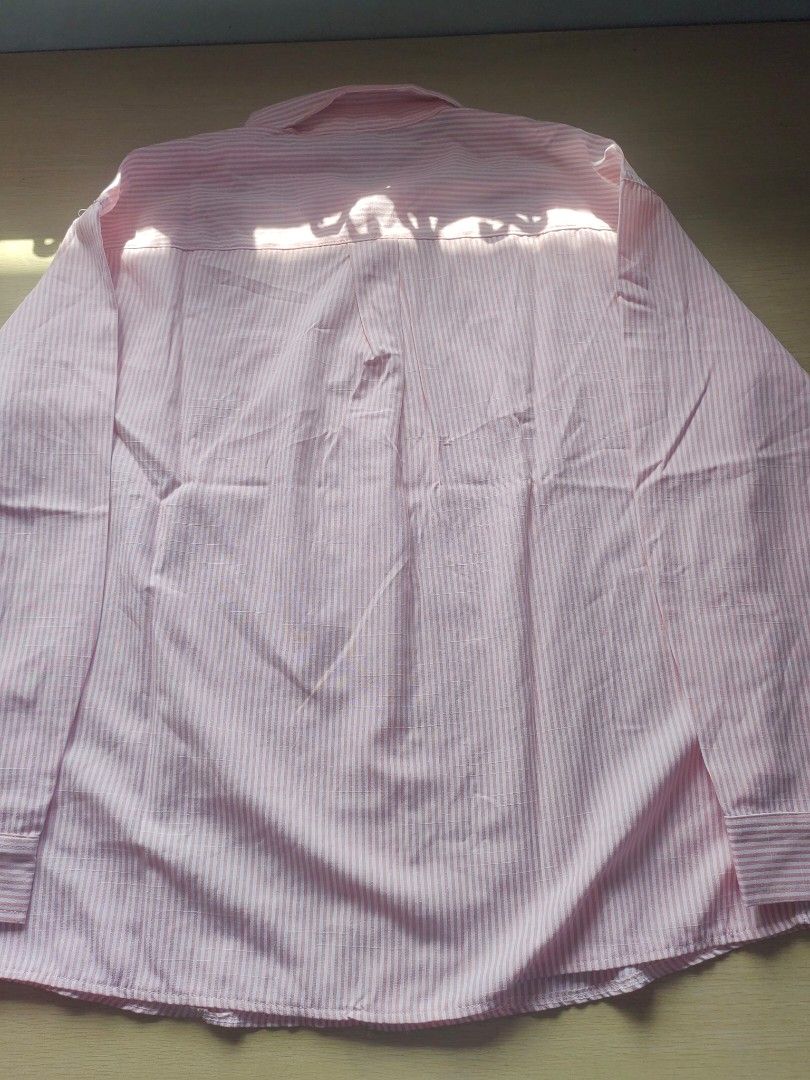 Pink Striped Button-Up Longsleeve (Category: Tshirts & Polo Shirts ) located in Quezon City. Submitted by brycine022416 (Listing ID 1460074299, Image 2). Description: - Classic pink and white striped button-up shirt - Long sleeves with button cuffs - Single chest pocket - Ideal for smart casual or work attire - Measurements available in photos.