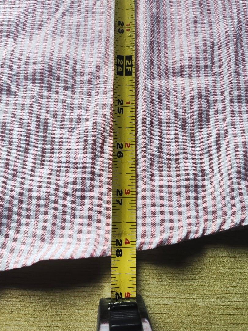 Pink Striped Button-Up Longsleeve (Category: Tshirts & Polo Shirts ) located in Quezon City. Submitted by brycine022416 (Listing ID 1460074299, Image 3). Description: - Classic pink and white striped button-up shirt - Long sleeves with button cuffs - Single chest pocket - Ideal for smart casual or work attire - Measurements available in photos.
