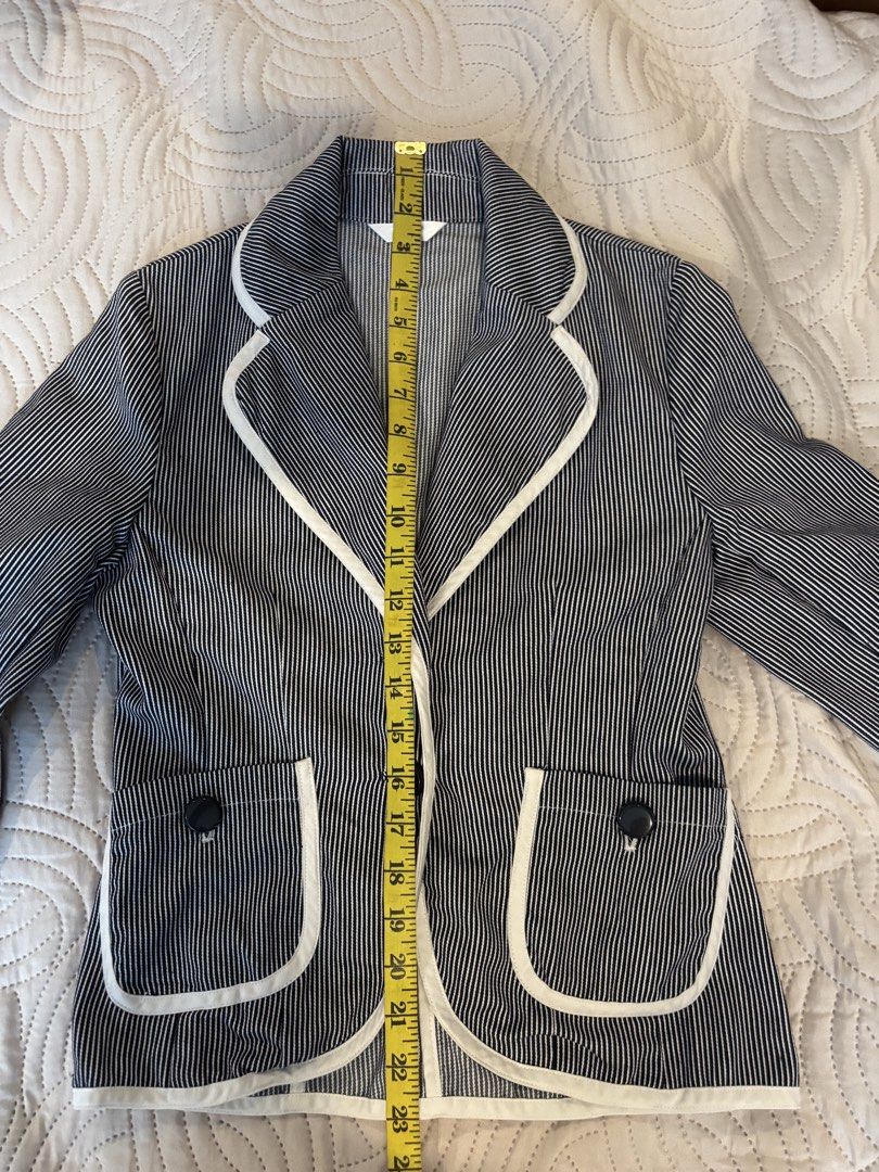Pinstripe Blazer and Flare Pants Set (Category: Sets or Coordinates) located in Cabuyao City. Submitted by thriftedwonders18 (Listing ID 1460006324, Image 1). Description: - Classic pinstripe blazer and flare pants set - Blazer: White trim, two-button closure - Pants: High-waisted, double button closure - Perfect for professional or casual outfits - Detailed measurements for blazer and pants included in photos.