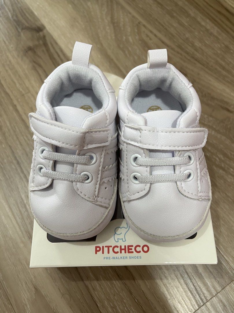 Pitcheco Pre-Walker Shoes White Size 12 (6-9 Months) (Category: Babies & Kids Fashion) located in Manila. Submitted by shannendorithie (Listing ID 1460019015, Image 1). Description: - Brand: Pitcheco - Type: Pre-walker shoes - Color: White - Size: 12 (fits 6-9 months) - Features: Easy velcro strap for quick on/off - Condition: Comes in original box - Ideal for: Babies starting to take their first steps!.
