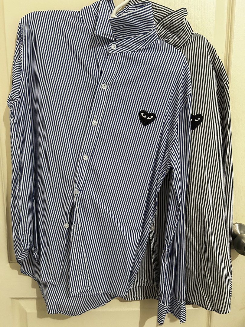 PLAY CDG Striped Long Sleeves Bundle (2) (Category: Longsleeves) located in Roxas City. Submitted by preloved_by_workingstudent (Listing ID 1459920857, Image 1). Description: - COMME des GARÇONS striped button-up shirt - Features iconic heart logo on chest - Available in Blue/White stripes (Width - 20 1/2, Length - 25) *tag fell off / no tag *Size L indicated - Available in Grey/White stripes ( Width - 22, Length - 26) P1000 for 2 shirts + SF .