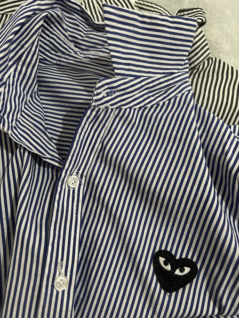 PLAY CDG Striped Long Sleeves Bundle (2) (Category: Longsleeves) located in Roxas City. Submitted by preloved_by_workingstudent (Listing ID 1459920857, Image 3). Description: - COMME des GARÇONS striped button-up shirt - Features iconic heart logo on chest - Available in Blue/White stripes (Width - 20 1/2, Length - 25) *tag fell off / no tag *Size L indicated - Available in Grey/White stripes ( Width - 22, Length - 26) P1000 for 2 shirts + SF .