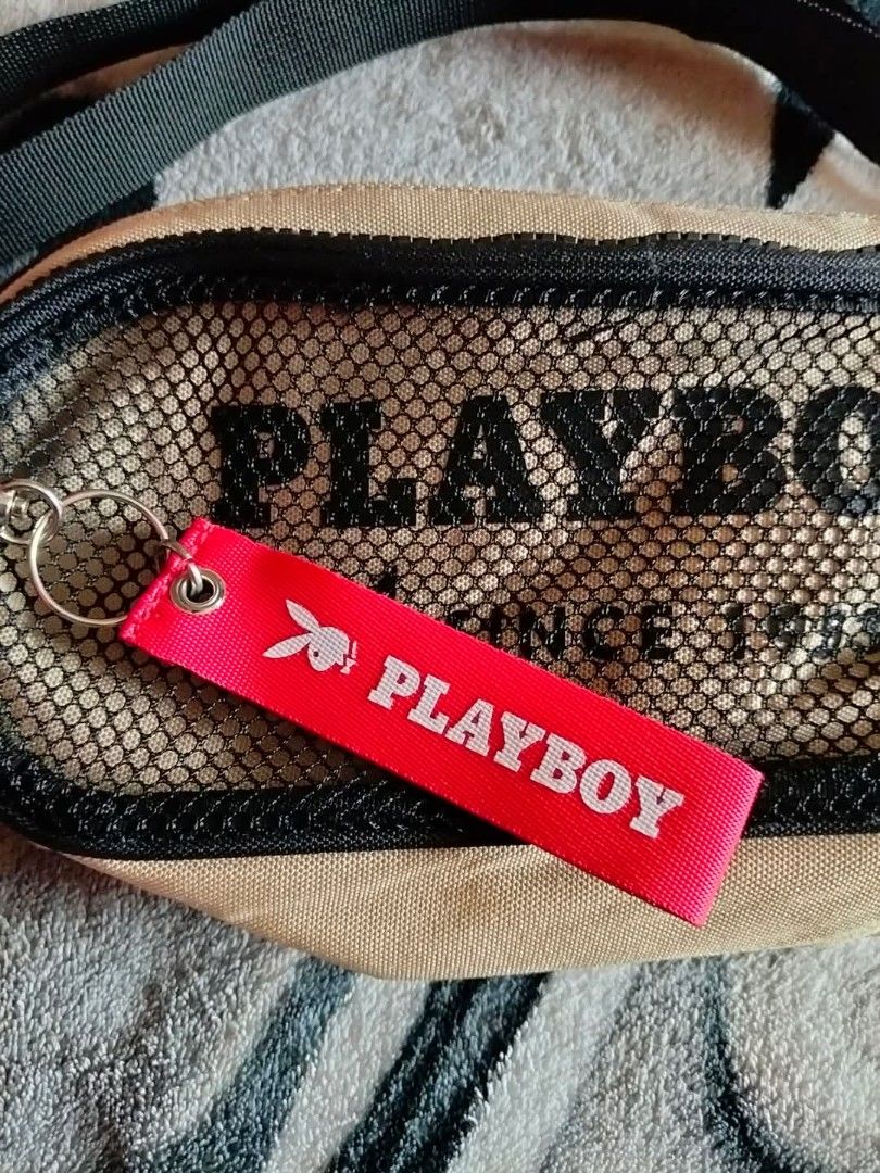 Playboy Bunny Beige Mesh Waist Bag (Category: Cross-body Bags) located in Mangaldan. Submitted by niftythrifty69 (Listing ID 1459959112, Image 2). Description: - Cool beige Playboy Bunny waist bag - Features a mesh front pocket with Playboy logo - Includes a red Playboy keychain - Adjustable strap for a comfortable fit - Perfect for carrying essentials hands-free - Great for festivals and everyday use.