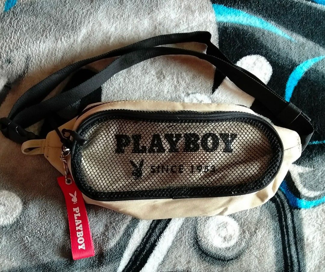 Playboy Bunny Beige Mesh Waist Bag (Category: Cross-body Bags) located in Mangaldan. Submitted by niftythrifty69 (Listing ID 1459959112, Image 1). Description: - Cool beige Playboy Bunny waist bag - Features a mesh front pocket with Playboy logo - Includes a red Playboy keychain - Adjustable strap for a comfortable fit - Perfect for carrying essentials hands-free - Great for festivals and everyday use.