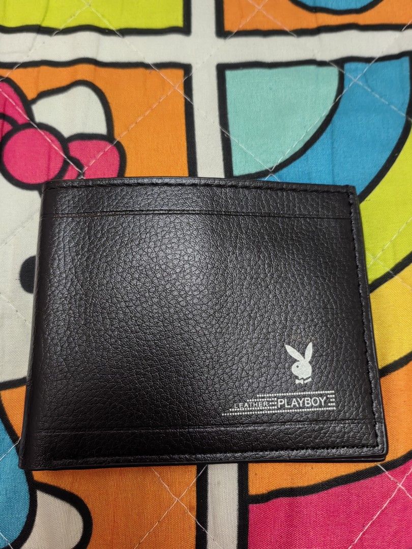 Playboy Leather Wallet and Belt Set (Category: Luxury Bags & Wallets) located in Mexico. Submitted by kitty_go (Listing ID 1460015058, Image 2). Description: - Playboy black leather bifold wallet - Multiple card slots and clear ID window - Black leather belt with silver buckle - Cute Kitty detail on belt keeper - Both items in original packaging.