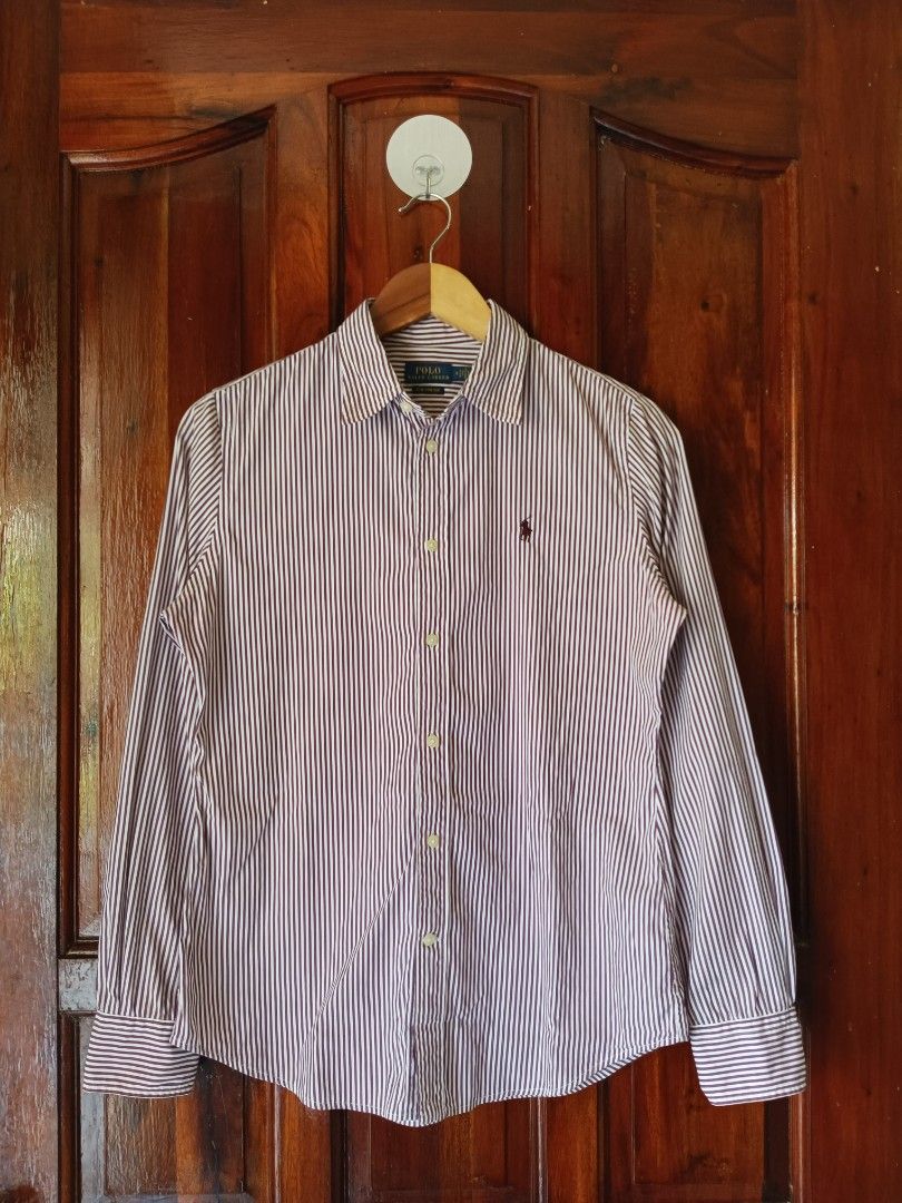 Polo Ralph Lauren Striped Button-Up Shirt (Category: Longsleeves) located in Tagbilaran City. Submitted by kennlouise13 (Listing ID 1459979054, Image 1). Description: - Classic Polo Ralph Lauren button-up shirt - Crisp white and dark red pinstripe pattern - Iconic embroidered Polo logo on chest - Long sleeves with button cuffs - Versatile for smart casual or formal occasions - Sharp and clean aesthetic.