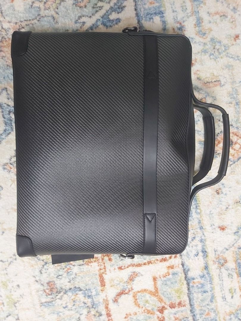 Porsche Design Carbon Fiber Briefcase (Category: Briefcases) located in Taguig. Submitted by wongmengwei91765 (Listing ID 1459971870, Image 2). Description: - Authentic Porsche Design briefcase - Made with premium carbon fiber - Sleek black leather trim and handle - Comes with original tag - Perfect for a professional look at work or during travel.