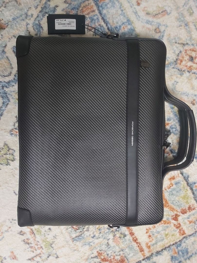 Porsche Design Carbon Fiber Briefcase (Category: Briefcases) located in Taguig. Submitted by wongmengwei91765 (Listing ID 1459971870, Image 1). Description: - Authentic Porsche Design briefcase - Made with premium carbon fiber - Sleek black leather trim and handle - Comes with original tag - Perfect for a professional look at work or during travel.