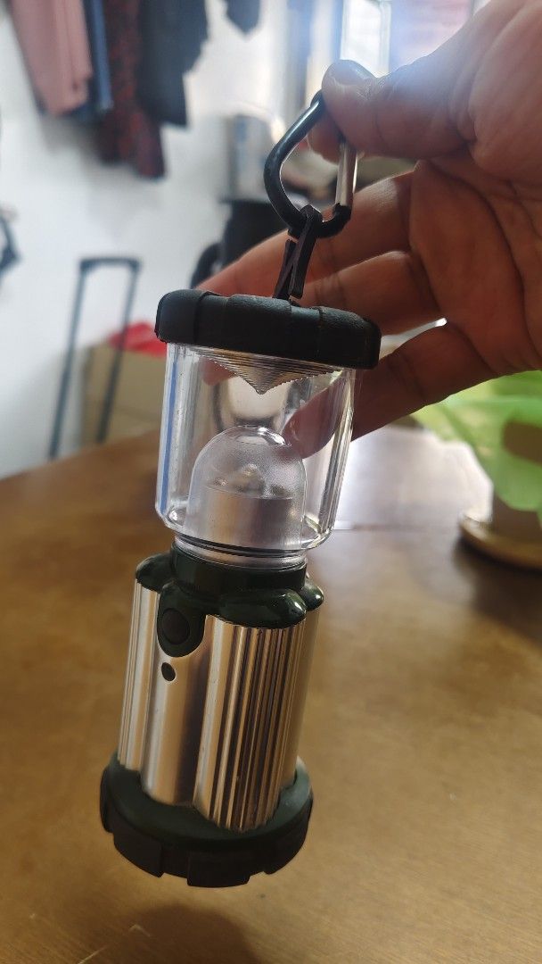 Portable LED Camping Lantern with Carabiner Clip (Category: Hiking & Camping) located in Bulacan. Submitted by babz30261 (Listing ID 1460001387, Image 1). Description: - Compact LED lantern - Features a carabiner clip for easy hanging - Ideal for camping, emergencies, and power outages - Small and lightweight design - Tested and works well - Ready for your next adventure!.