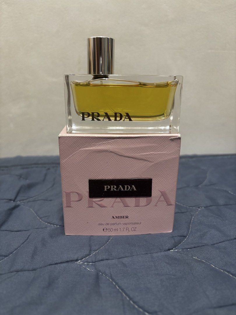 Prada Amber Eau De Parfum (Category: Fragrance & Deodorants) located in Manila. Submitted by declutter_byjaq (Listing ID 1460028340, Image 2). Description: Prada Amber Eau De Parfum 50ml Given as a gift (not my type of scent) From US Brandnew with Box Selling low para mabilis mabili🥰 RFS: Needs Cash.