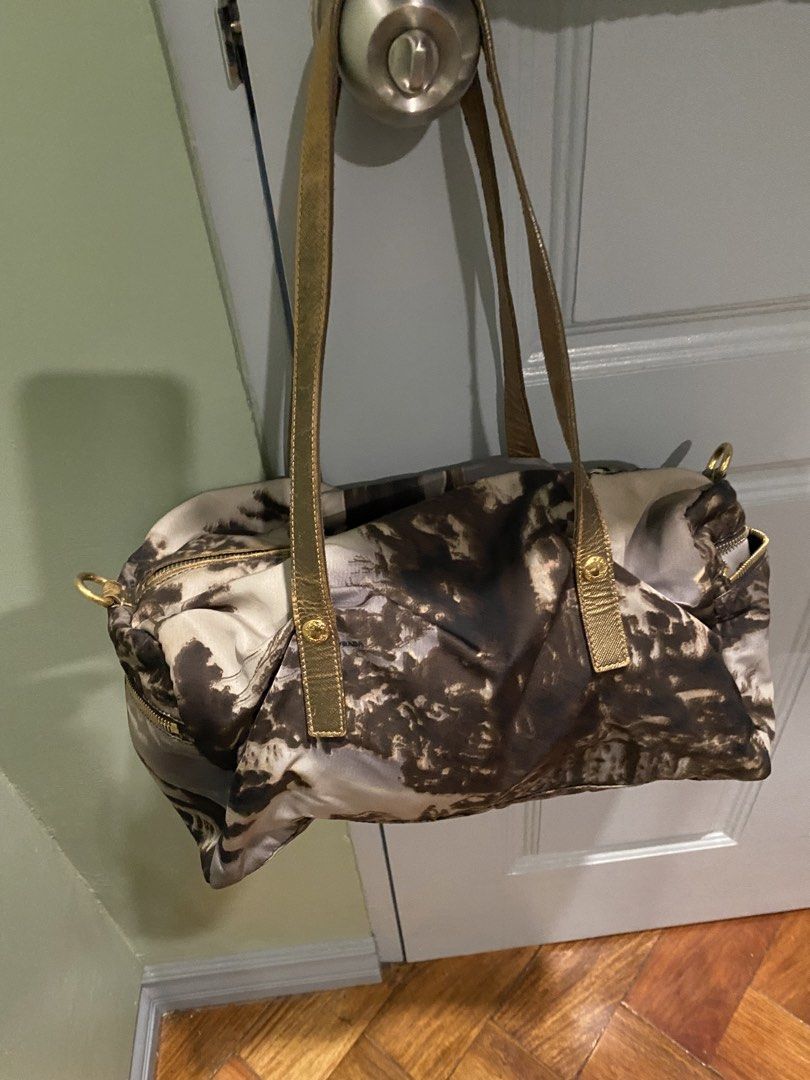 Prada Milano Nylon Print Shoulder Bag (Category: Luxury Bags & Wallets) located in Cebu City. Submitted by simpleabundance (Listing ID 1459903927, Image 2). Description: - Authentic Prada bag - Unique print - Gold hardware details - Leather straps - Smooth working zippers - Perfect size for daily essentials - Shows some signs of wear on straps and hardware - Stylish Prada piece.